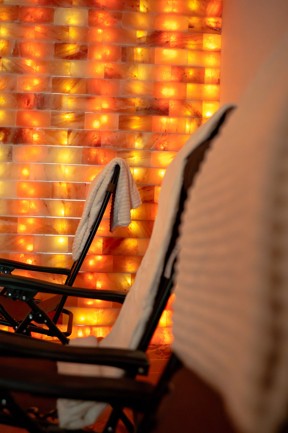 Warmly lit Himalayan salt room at Cambria Academy