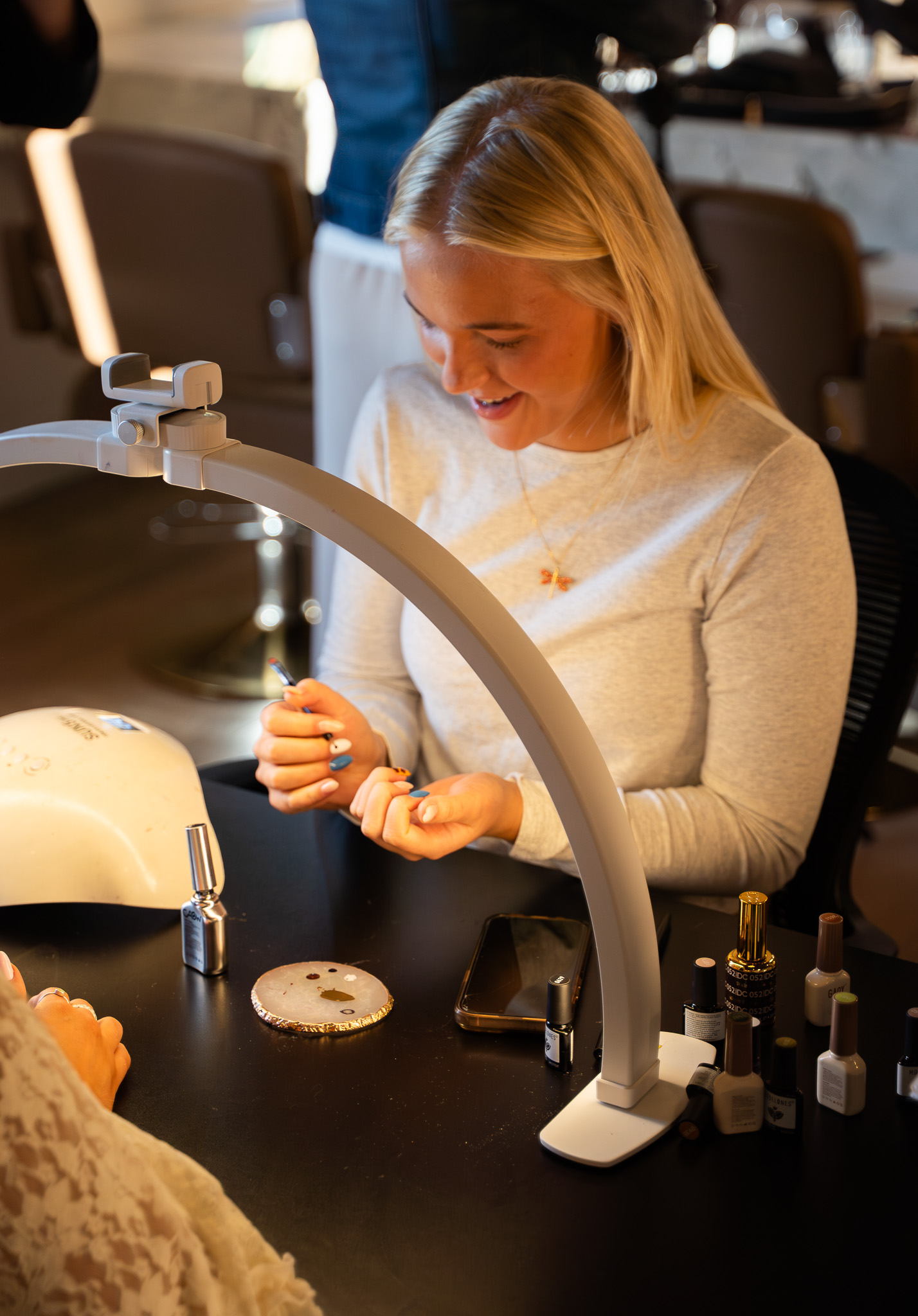 A Cambria Academy student practicing a nail service