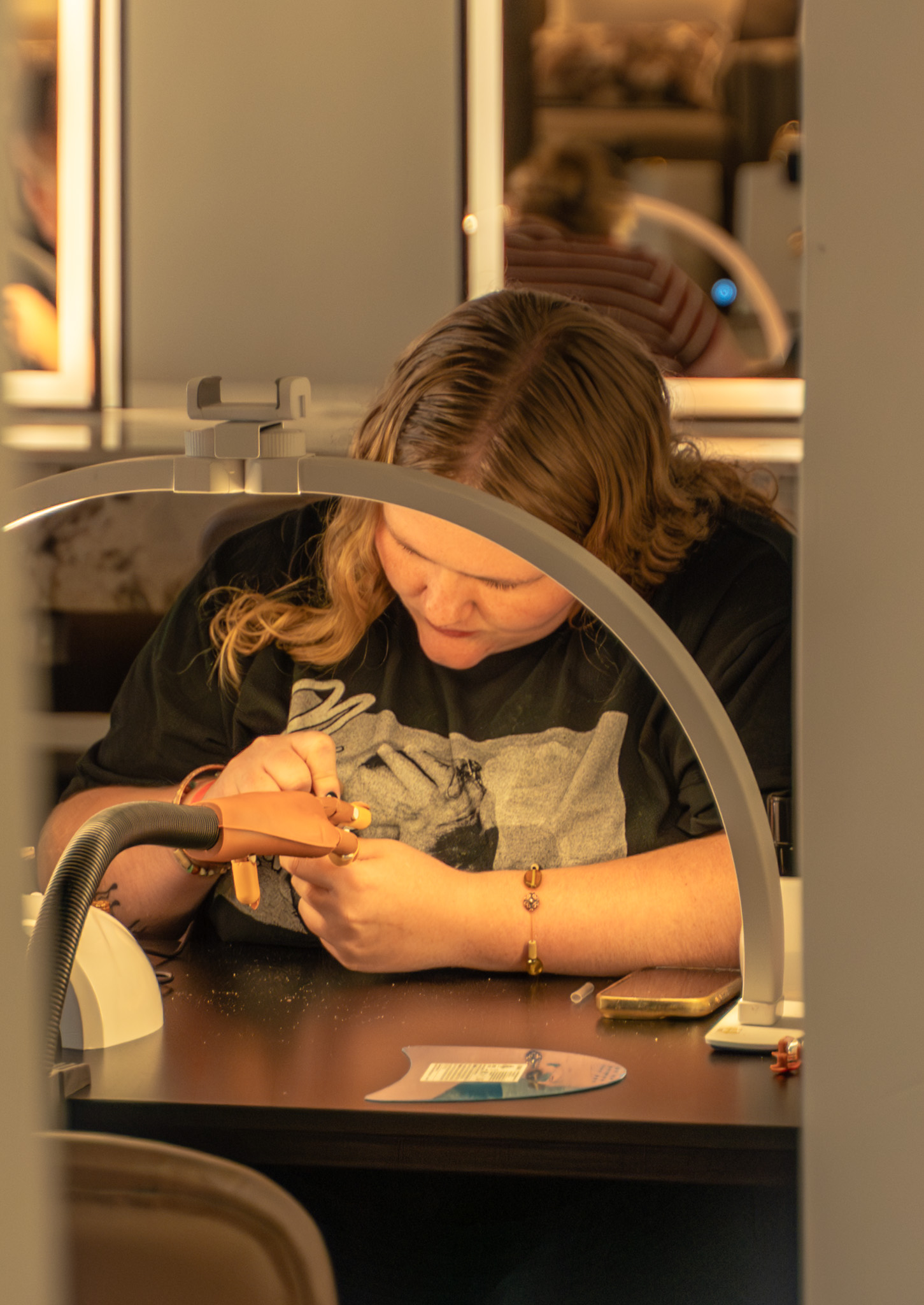 A Cambria Academy student practicing nail techniques